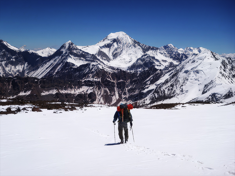 Mountaineer on the summit of Cerro Tupungato.