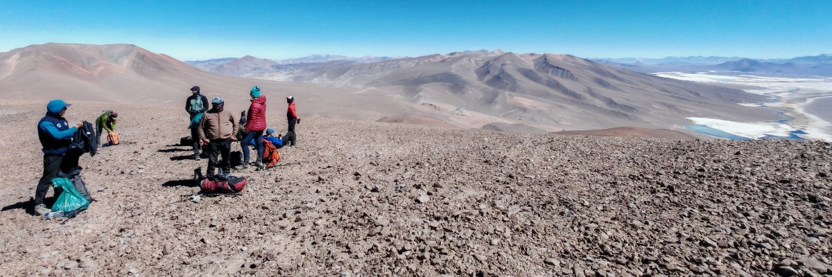 An HME guide with a client at a high-altitude camp, symbolizing planning and safety.
