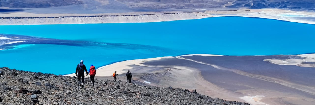 Split view comparing the snowy peaks of Aconcagua and the volcanic landscape of Ojos del Salado