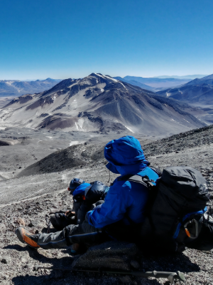 Mountaineer equipped with a heavy down parka and climbing hardware
