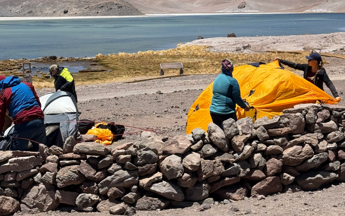 Mountaineers pitching high-altitude tents at Santa Rosa campsite, Ojos del Salado expedition.