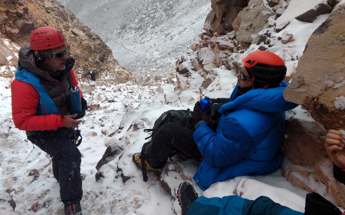 Climbers resting during the final moments before the summit of Ojos del Salado, the highest volcano in the world.