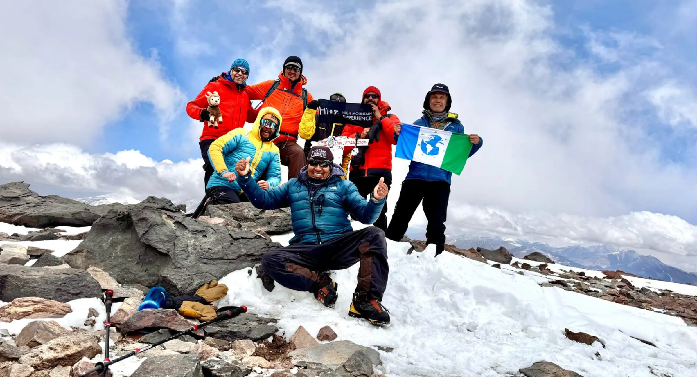 HME reviews: climbers celebrating on the summit